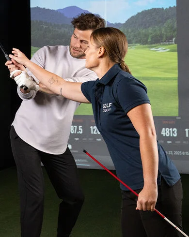 professional giving a golf lesson
