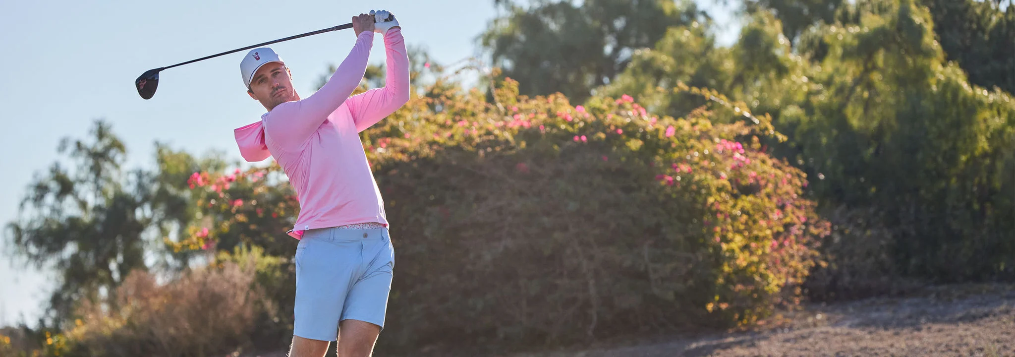 A man teeing off.