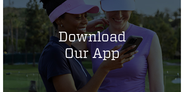 A woman looking at her rewards on her phone.